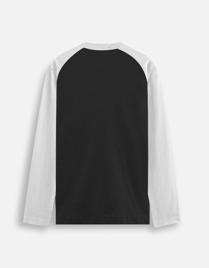 Back view of black and white long sleeve baseball-style raglan shirt on plain background