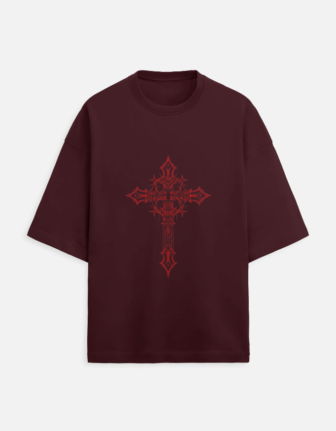 Maroon oversized t-shirt with intricate red cross graphic design on front