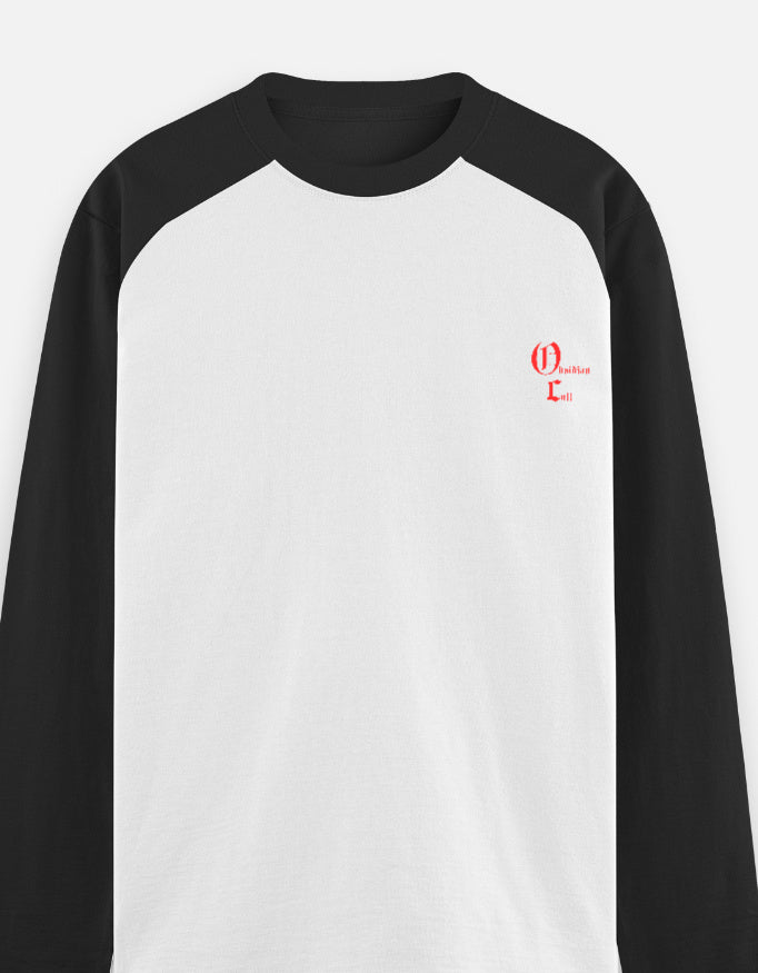 Black and white raglan long-sleeve shirt with small red gothic text logo on left chest