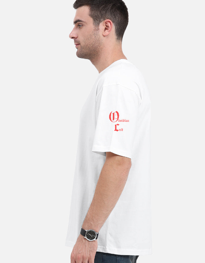 Side profile of man wearing white t-shirt with red Obsidian Cult graphic on left sleeve against plain background