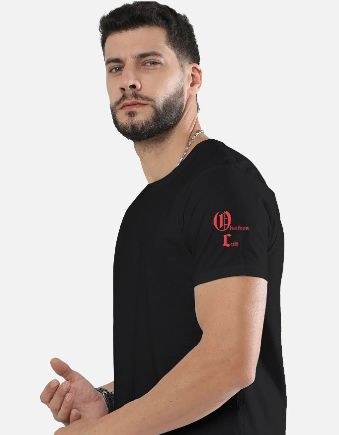 Man with beard wearing black t-shirt featuring red Obsidian Cult logo on left sleeve