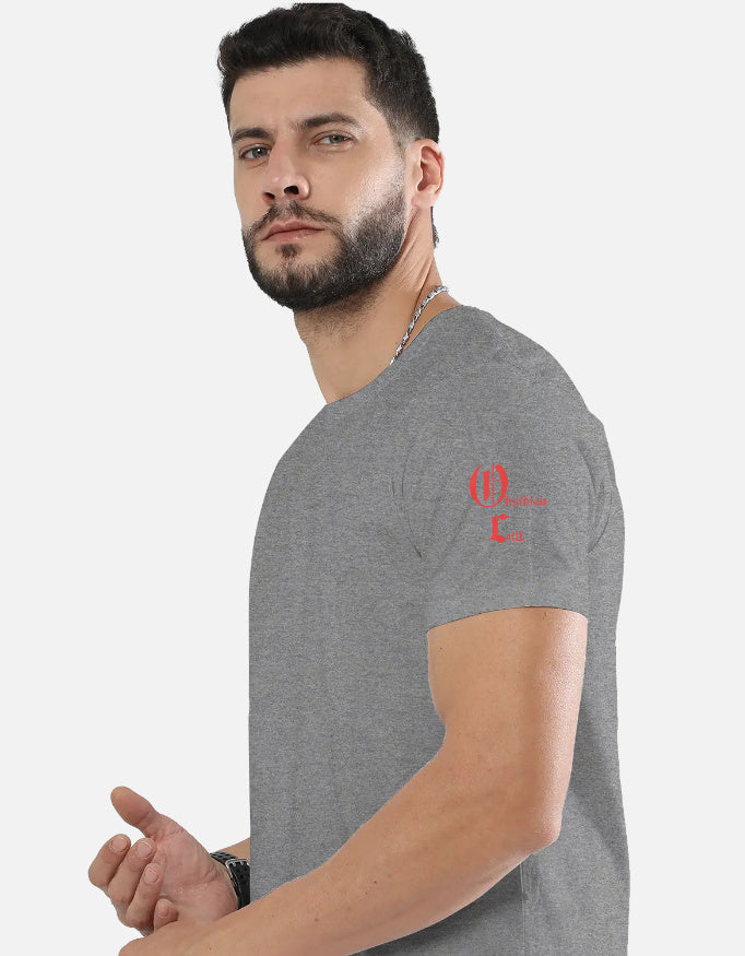 Man wearing a gray t-shirt with red text design on left shoulder against white background